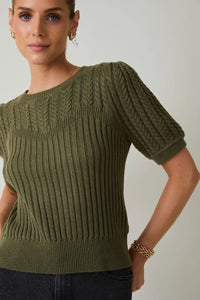 Olive green ribbed knit sweater with round neck puff short sleeve featuring a textured sleeve cable knit pattern