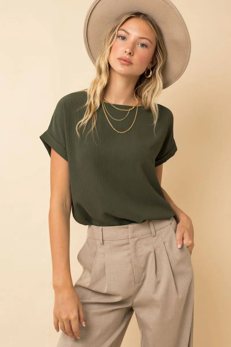 Olive green short roll up sleeve top with relaxed fit and subtle texture featured in women’s boho chic clothing shop daisy