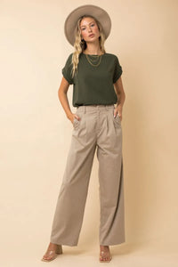 Olive green short roll up sleeve top with relaxed fit and subtle waistband pleats from shop daisy womens boho chic clothing