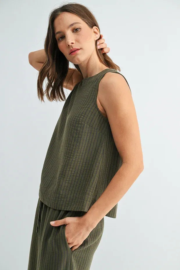 Olive green sleeveless top with subtle vertical ribbed texture and stripe button back from women’s boho chic clothing shop daisy