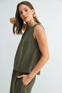 Olive green sleeveless top with subtle vertical ribbed texture and stripe button back from women’s boho chic clothing shop daisy