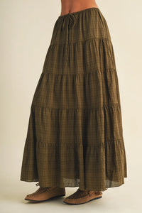Olive green geometric woven tiered maxi skirt with subtle plaid pattern and gathered waistband detail