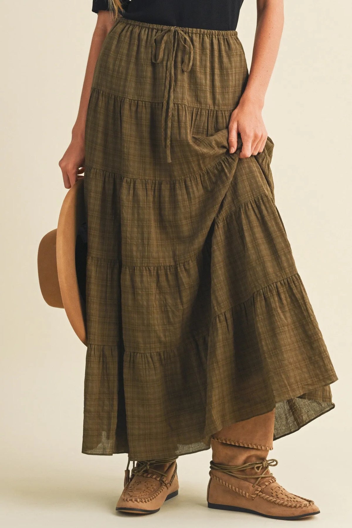 Olive green geometric woven tiered maxi skirt with subtle plaid pattern and elastic waistband for comfortable wear