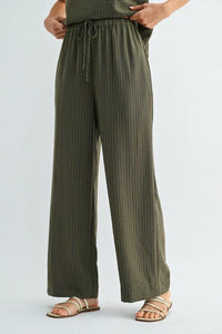 Olive green vertically striped wide-leg pants with elastic waist tie and drawstring for comfortable fit