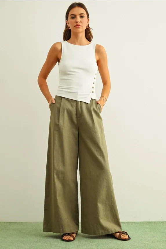 Olive green wide-leg trousers with relaxed pleats and ribbed button details for women’s boho chic clothing
