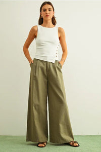 Olive green wide-leg trousers with relaxed pleats and ribbed button details for women’s boho chic clothing