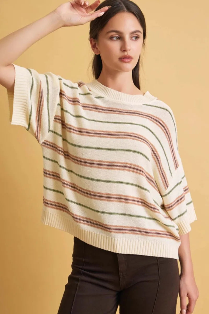 A soft cream oversized cut half sleeve striped sweater with wide terracotta and olive green horizontal stripes
