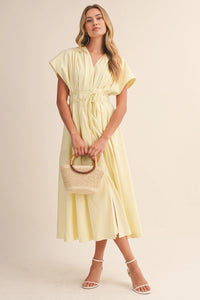 Pale yellow poplin short sleeve belted maxi dress with v-neckline and flutter sleeves mid-calf length
