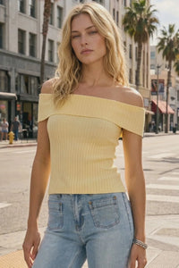 A pale yellow off shoulder ribbed fitted top with a silhouette designed for a flattering fit