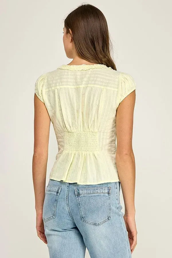 Pale yellow short-sleeved ruffle trim v-neck blouse with smocked waist and ruffled hem for stylish wear