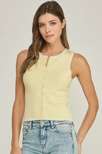 A pale yellow sleeveless scallop trim knit top with front button closure and scalloped neckline and hem