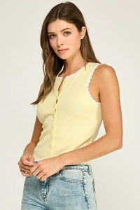 Pale yellow sleeveless scallop trim knit top with scalloped neckline and front button closure