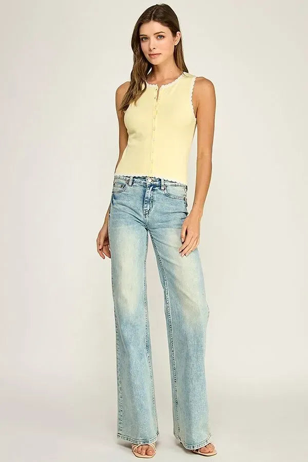 A pale yellow sleeveless scallop trim knit top with button-front closure and scalloped neckline trim knit design