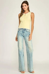 A pale yellow sleeveless scallop trim knit top with button-front closure and scalloped neckline trim knit design