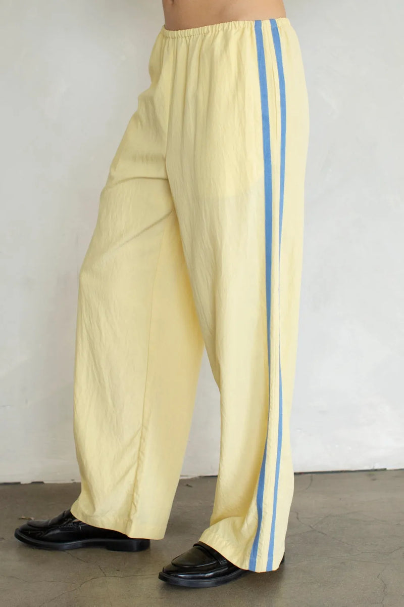 Pale yellow landon track wide-leg pants with pocket and double light blue stripes for casual wear