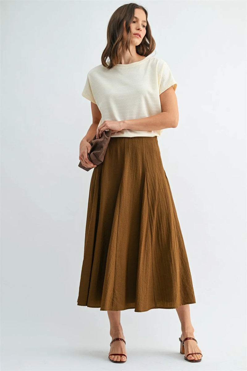 A flowing brown godet midi skirt with pleats and a soft lightweight fabric featuring a side zipper closure