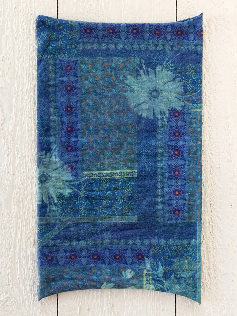 Rectangular blue quilted boho bandeau headband with patchwork floral and geometric patterns accented by teal and orange