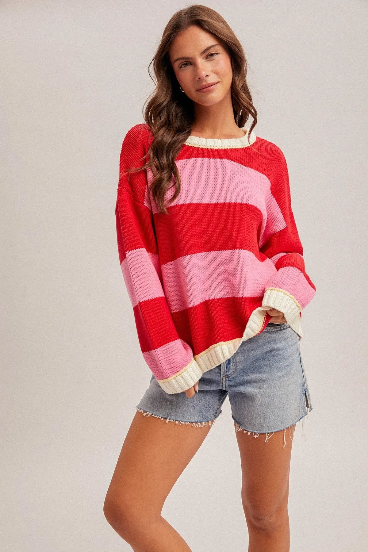 Crew neck relaxed oversized sweater in red pink stripes with cream trim