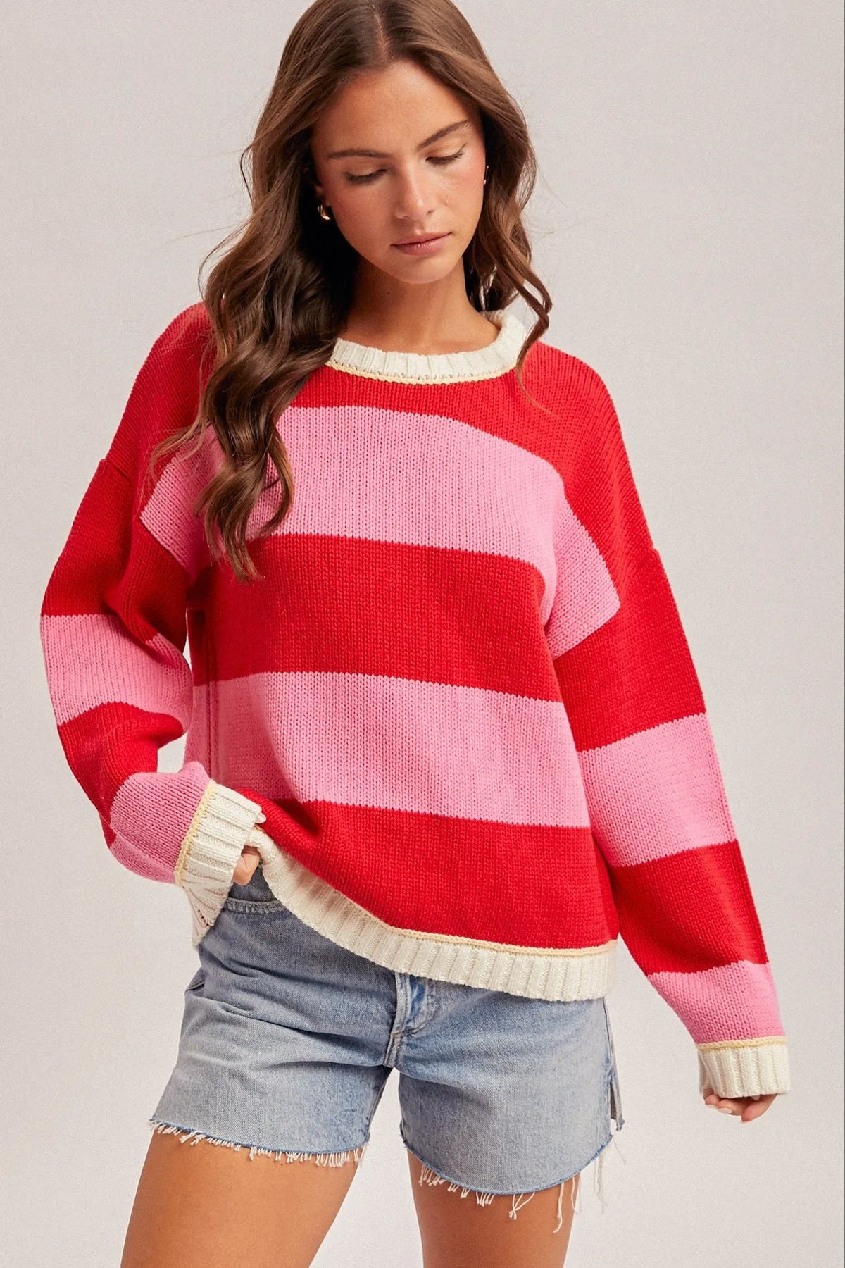 Crew neck relaxed oversized sweater in red pink stripes with cream trim