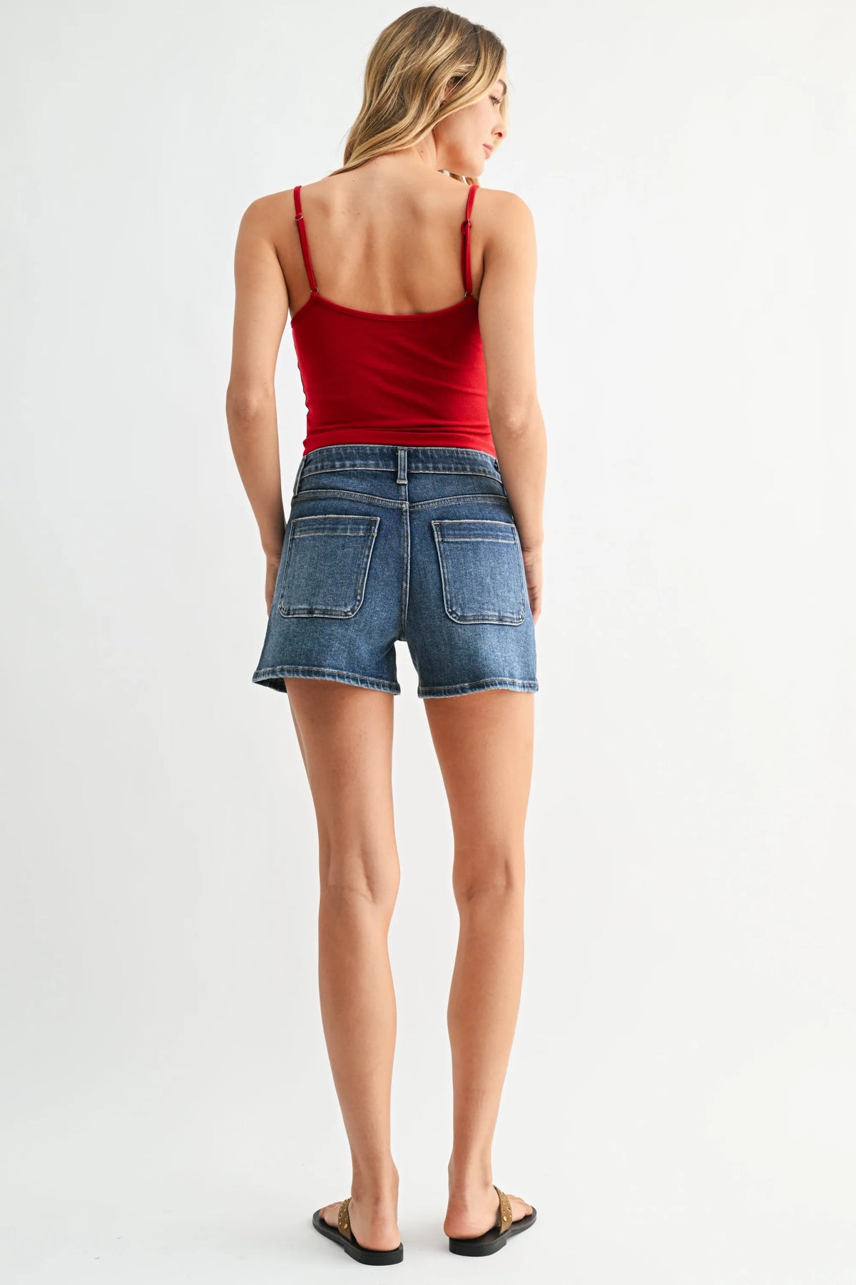 Mid rise western pocket denim shorts with red spaghetti strap top