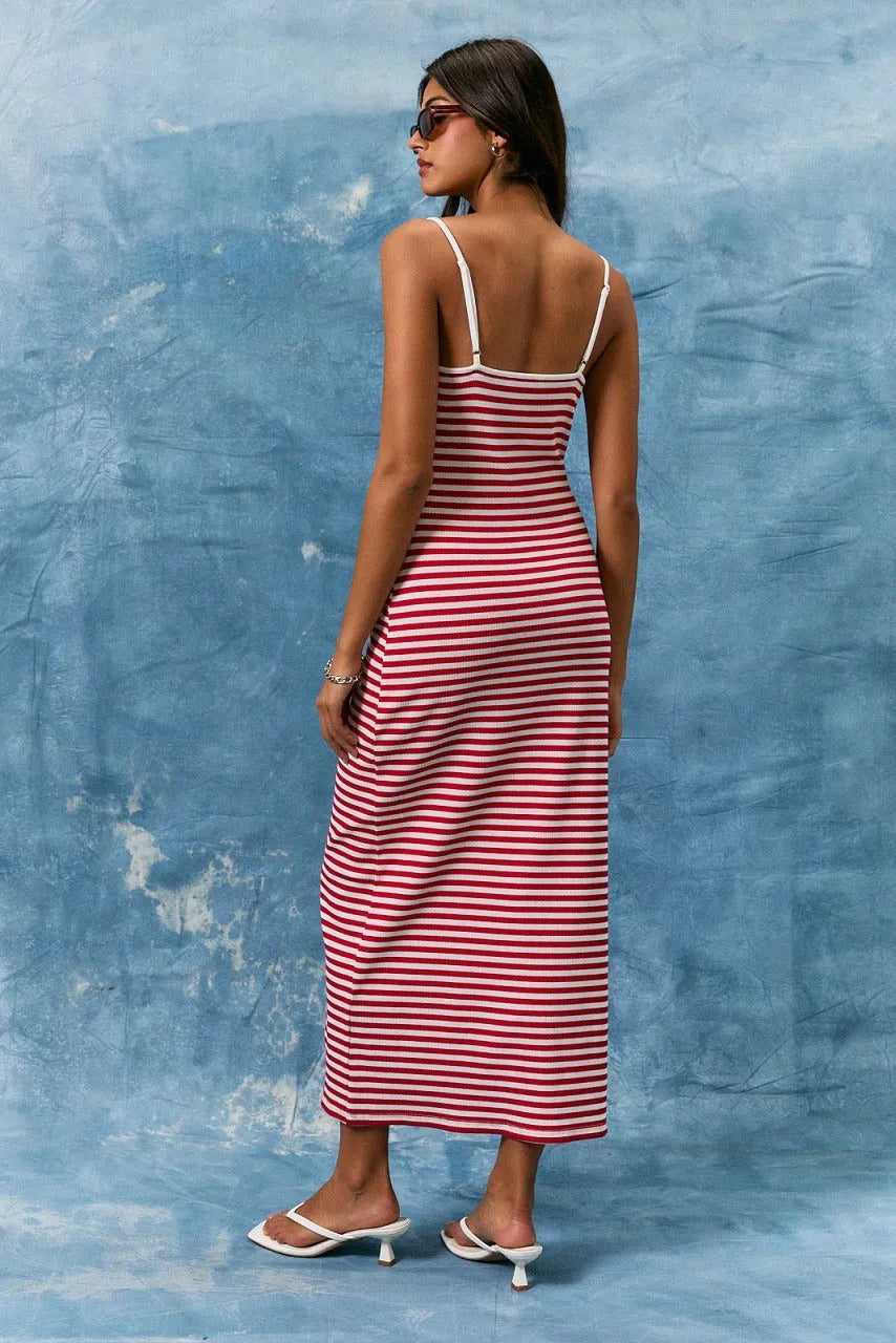 A fitted red and white striped spaghetti strap binding stripe midi dress with a flattering midi dress silhouette