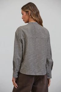 A relaxed-fit long-sleeved tied collar shirt in black and white plaid bow tied houndstooth pattern