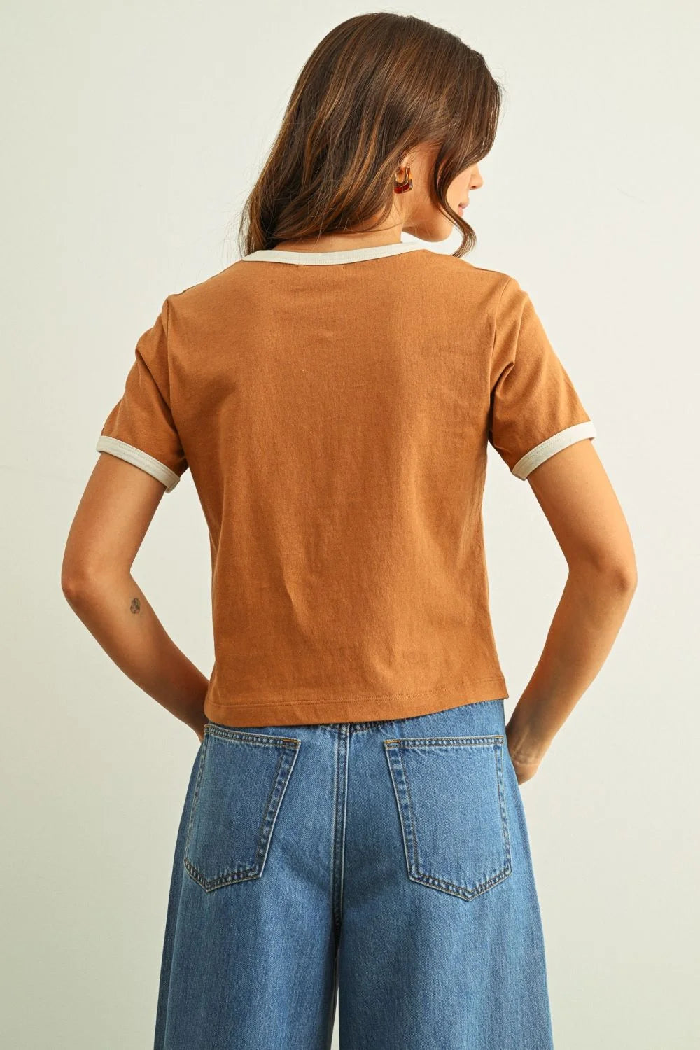 Rust-colored short sleeve ringer organic cotton top with white trim