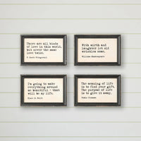 Set of four black-framed wood framed wall decor prints with typewriter style sayings for framed wall decor use