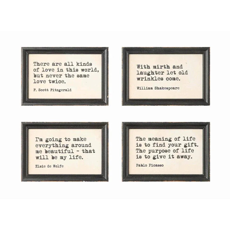 Set of four wood framed wall decor with typewriter style sayings in distressed black frames and cream backgrounds