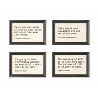 Set of four wood framed wall decor with typewriter style sayings in distressed black frames and cream backgrounds