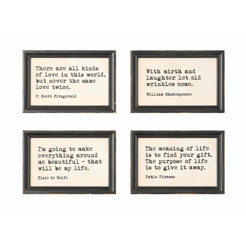 Set of four wood framed wall decor with typewriter style sayings in distressed black frames and cream backgrounds