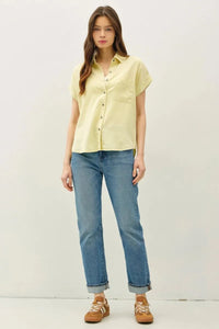 Light yellow short dolman sleeve button shirt with classic collar and subtle textured fabric for casual wear