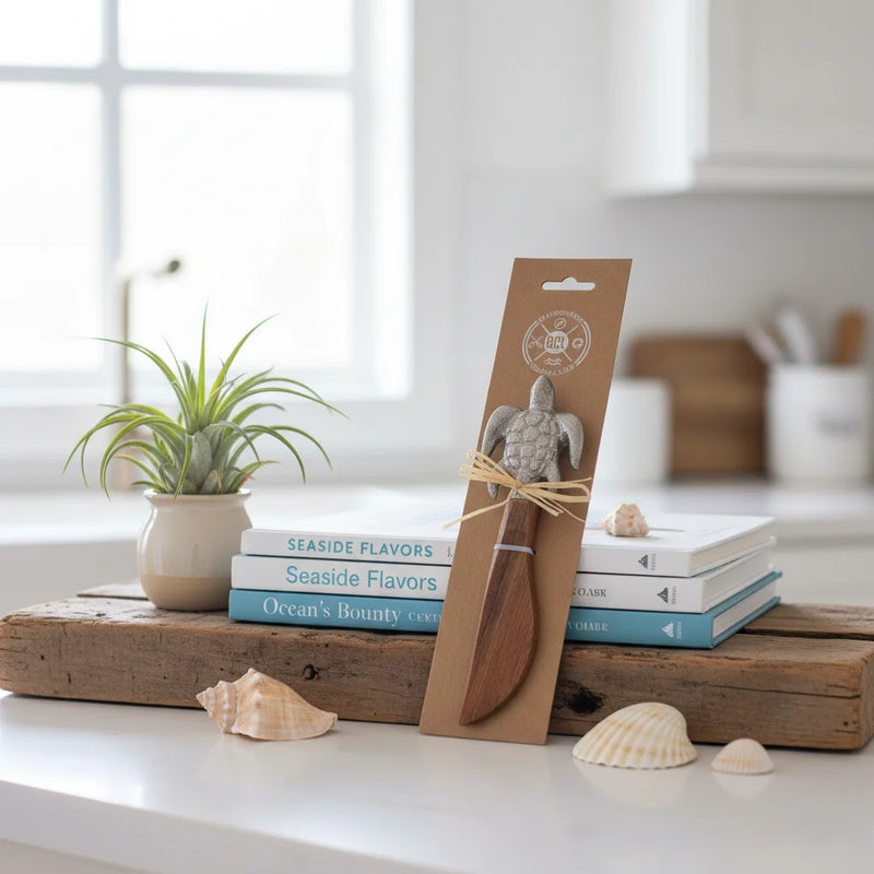 Decorative sea turtle spreader knife with wooden handle in sleeve