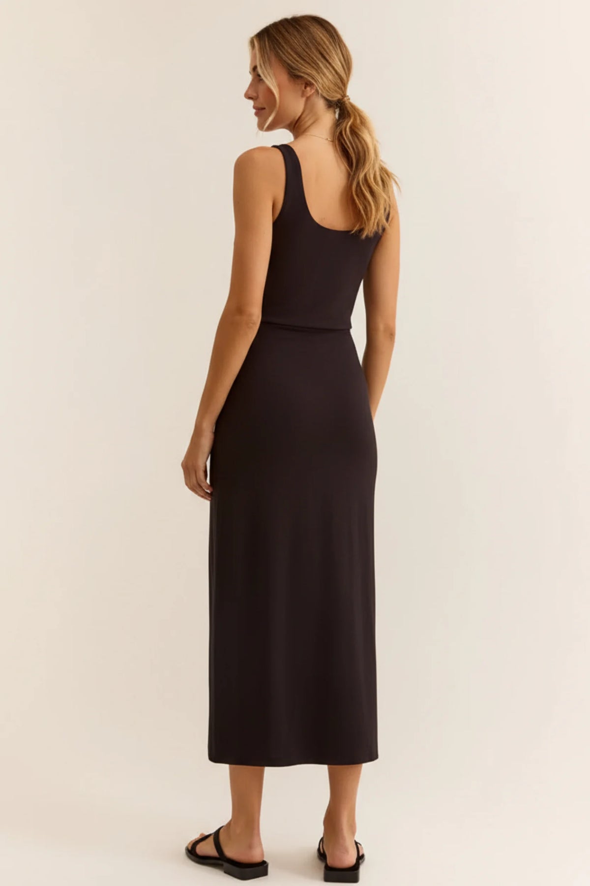 Sleek black sleeveless night fitted midi dress with fitted bodice and flowing skirt