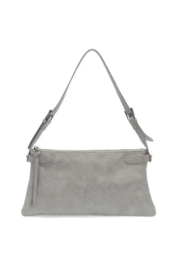 A sleek light gray eve trapeze vegan leather shoulder bag with minimalist design and adjustable strap