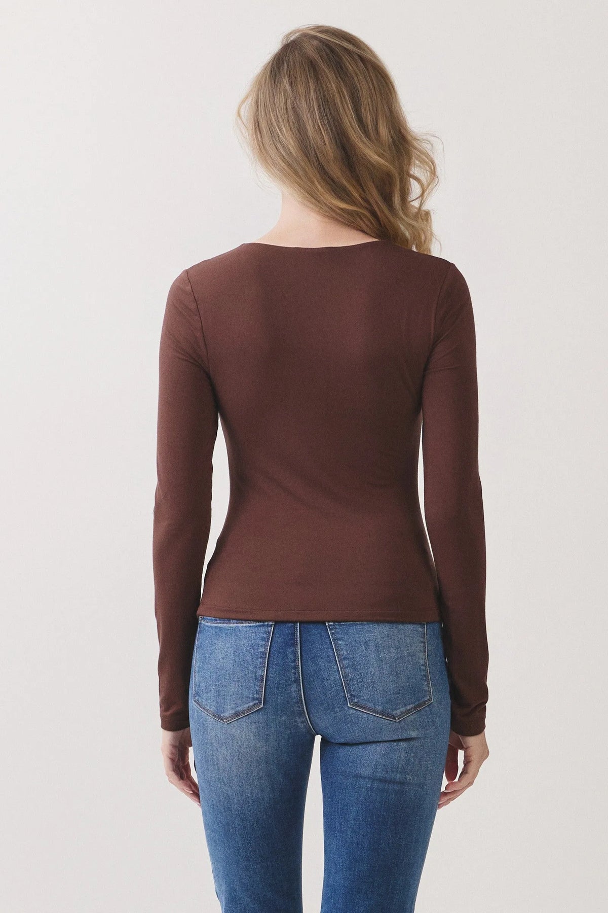 A sleek brown double layer v neck long sleeve basic top with fitted silhouette and subtle seam detailing