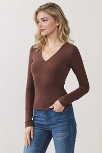 A sleek brown double layer v neck long sleeve basic top made of stretchy fabric with a comfortable fit