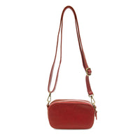 A sleek red leather layne double zip mini crossbody bag with adjustable strap and gold-tone hardware for daily use