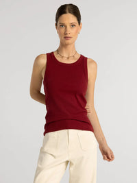 A sleek ribbed maroon sleeveless edlin basic tank with rounded neckline and subtle seam detailing by thread and supply