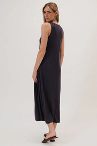 A sleek black sleeveless maxi dress with round neck narrow shoulder and flowing a line silhouette with subtle sheen