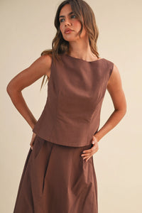 A sleek brown linen sleeveless peplum top with structured bodice ideal for stylish summer wear