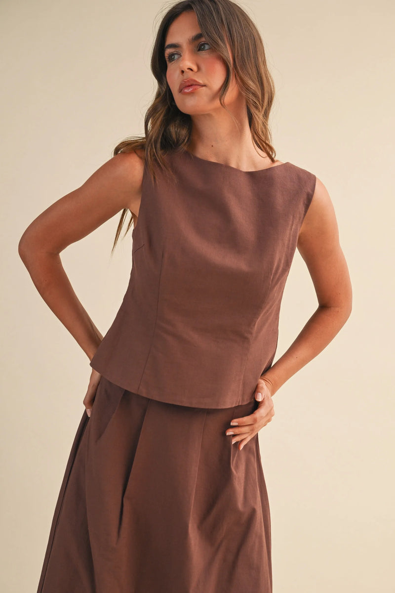 A sleek brown linen sleeveless peplum top with structured bodice ideal for stylish summer wear