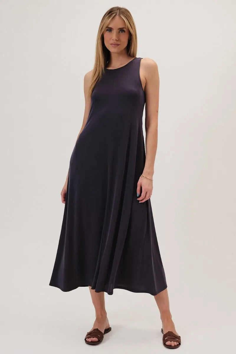 A sleek navy blue round neck narrow shoulder maxi dress with a flowing silhouette and subtle sheen
