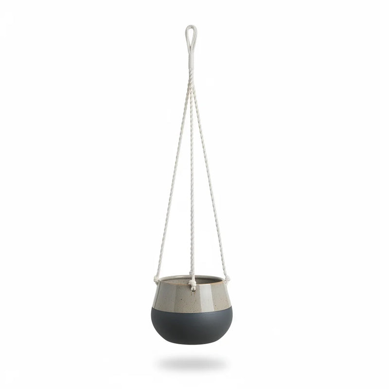 Modern two-tone ceramic hanging planter in gray and navy with cotton rope