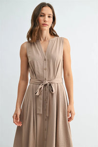 A sleeveless beige tie midi dress with v neck button front design and matching self-tie belt in lightweight fabric