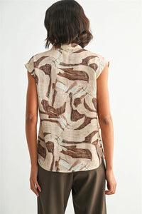 Geo print v neck sleeveless blouse with abstract earth toned beige and brown pattern perfect for casual wear