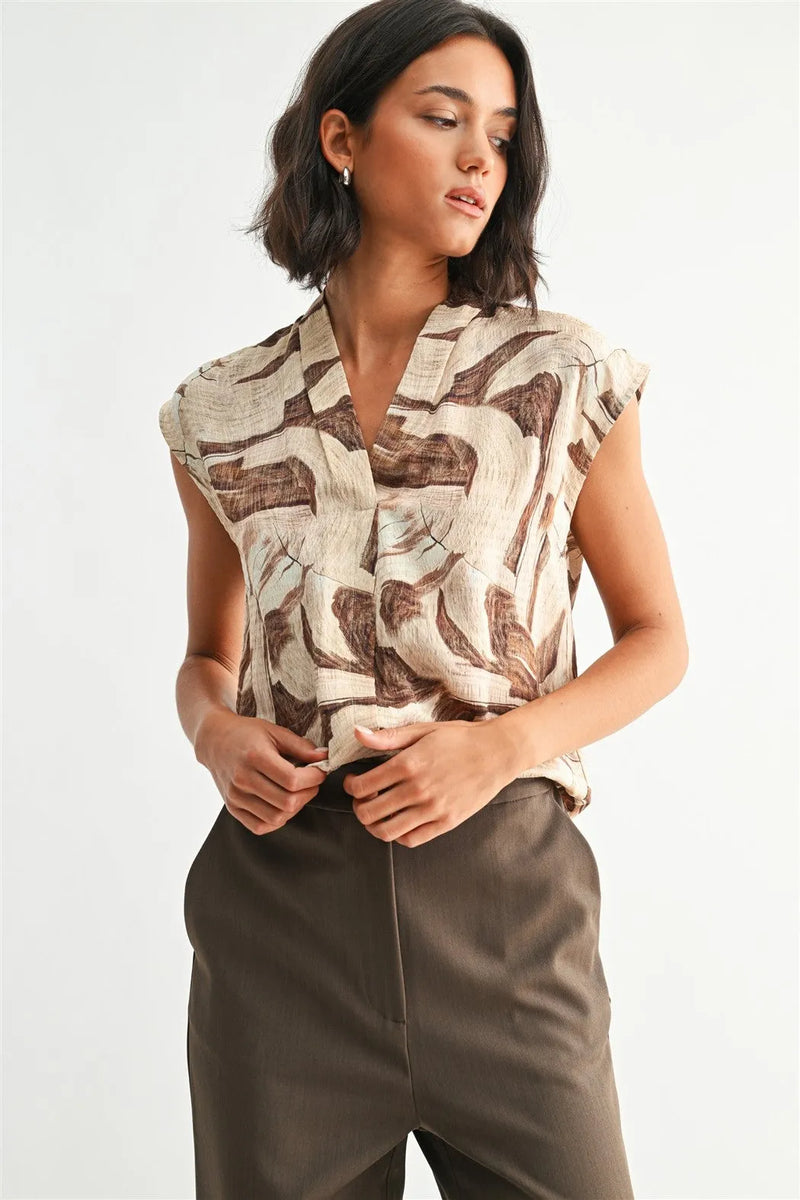 Geo print v neck sleeveless blouse with abstract brown beige leaf pattern made from lightweight fabric