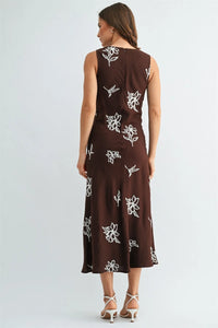 A brown embroidery sleeveless midi dress with white floral embroidery perfect for elegant occasions