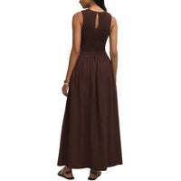 A sleeveless dark brown maxi dress with ribbed bodice and smocked waistband in juniper smocked maxi design