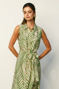 Wild tides shirt dress featuring a sleeveless green and cream leaf-patterned button-down design with belted waist